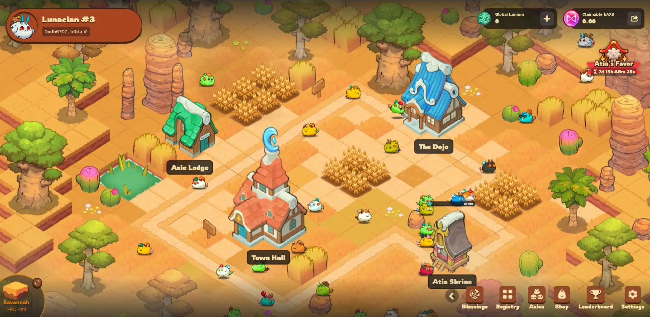 This screenshot from Axie Infinity displays an isometric view of a savannah map where various small creatures are scattered around buildings labeled as the Town Hall, The Dojo, and Atia Shrine.