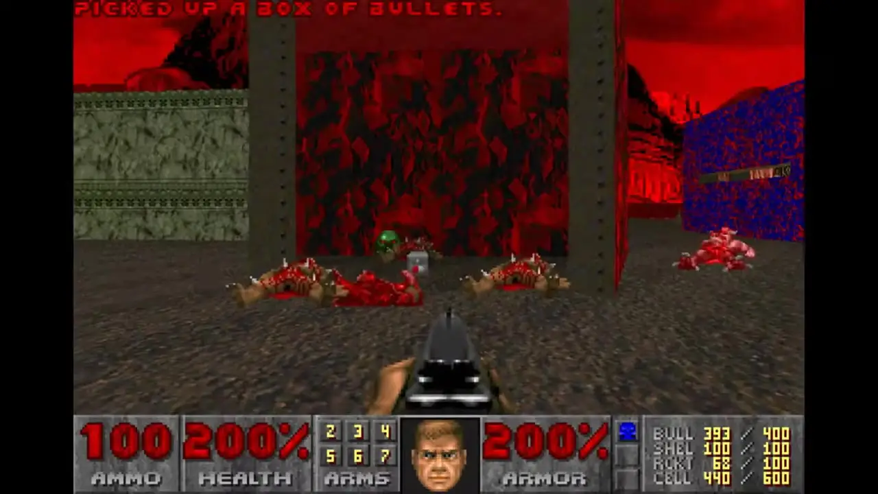 In this first-person screenshot from DoomSol, the player holds a pistol in an industrial corridor while looking at several defeated enemies on the ground beneath red lighting and near a wall of spikes.