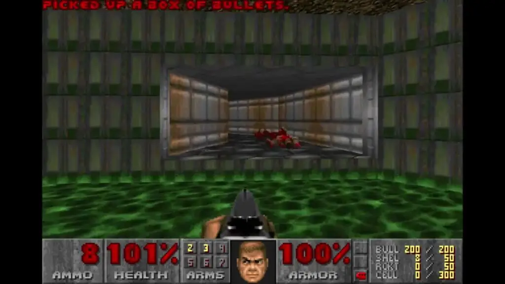 In this first-person perspective screenshot from DoomSol, the player character holds a pistol while standing in green slime and looking toward an alcove containing defeated red enemies beneath a notification that reads 'PICKED UP A BOX OF BULLETS'.