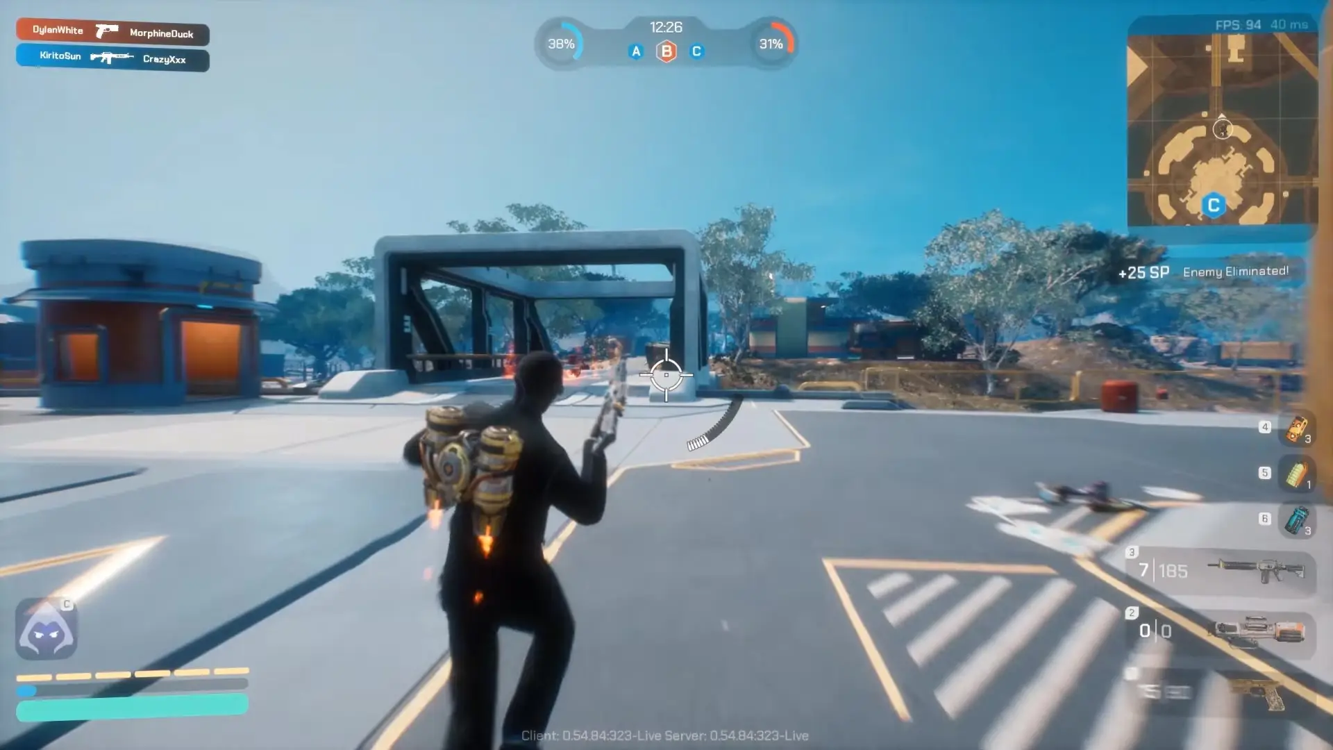 In the game Artyfact, a character equipped with a jetpack holds a weapon while moving through a futuristic outdoor area with structures and trees, and an enemy has been eliminated as indicated on the screen.