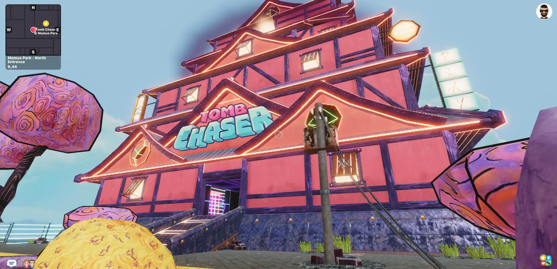 This screenshot from the game Decentraland shows a large, pink, multi-story building styled like a Japanese castle at night, featuring neon signs that read "TOMB CHASER" and "PLAY," alongside abstract purple trees under a blue sky.